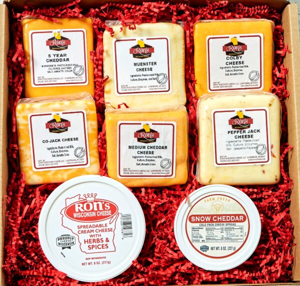 An array of cheese is a perfect gift for any cheese lover. Medium and 5 Year Cheddar, Muenster, Colby, Colby-Jack, and Pepper Jack block cheeses along with Herb's & Spice and Snow Cheddar Spread