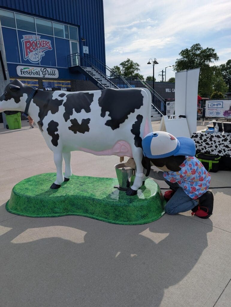 Rhodie Milking a cow